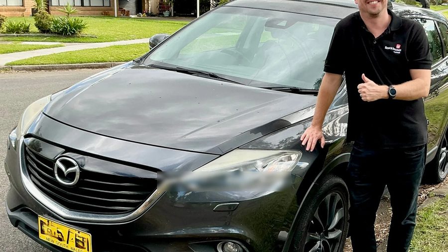CarBuyers team member with a Mazda CX-9